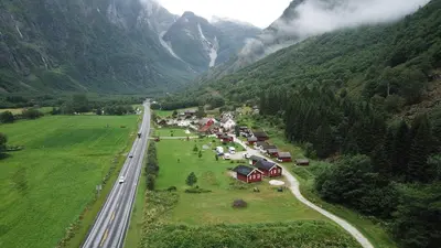 an aerial view of a village in the mountains at Gudvangen Camping in Gudvangen