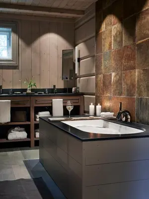a large bathroom with a large tub with a sink at Storfjord Hotel in Skodje