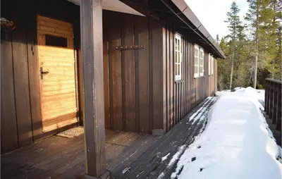 a front porch of a cabin in the snow at Four-Bedroom Holiday Home In Eggedal in Eggedal