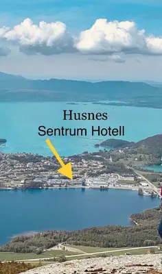 a view of a body of water with a city at Husnes Sentrum Hotell in Husnes