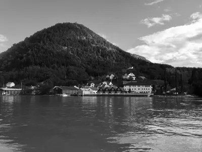 a black and white photo of a village on the water at Marifjøra Sjøbuer in Marifjora