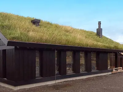 a grass roof on a building with a grassy hill at 10 person holiday home in Øyer in Øyer