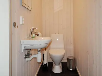 a small bathroom with a toilet and a sink at 10 person holiday home in Øyer in Øyer