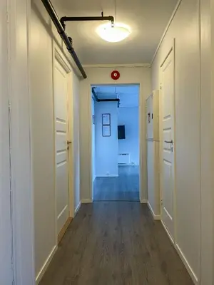an empty hallway with white walls and wooden floors at Hardangerpark AS in Kinsarvik