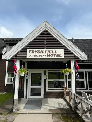 a hotel with a sign that reads trinityhill apartment hotel at Trysilfjell Apartment Hotel in Trysil