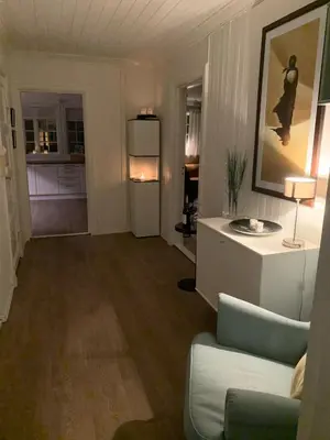 a living room with a couch and a chair at Høyanger 3 roms leilighet in Høyanger
