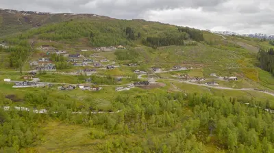 an aerial view of a village on a mountain at Fjellsporthytta nr. 4 in Sogndal