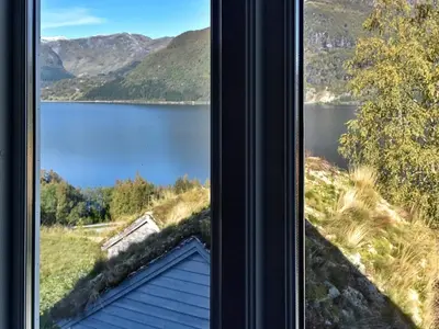 a view of a lake from a window at 10 person holiday home in skei i jølster in Årdal