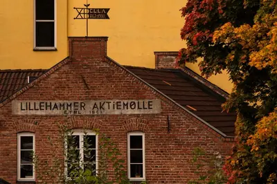 a brick building with a sign on top of it at Aksjemøllen - by Classic Norway Hotels in Lillehammer