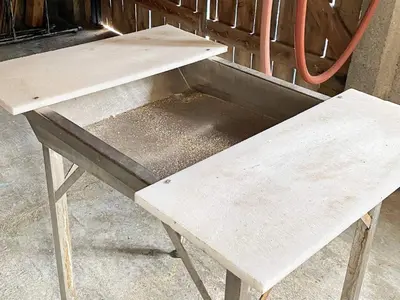 a wooden bench sitting on top of a table at 9 person holiday home in Reksteren in Haukafer