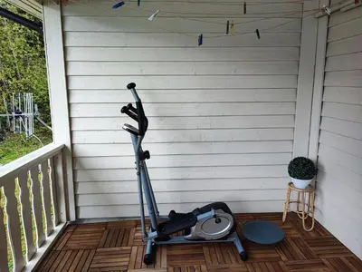 a scooter parked on a porch next to a wall at Visit Undredal in Undredal