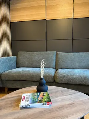 a living room with a couch and a coffee table at Blue House Dormitory in Odda