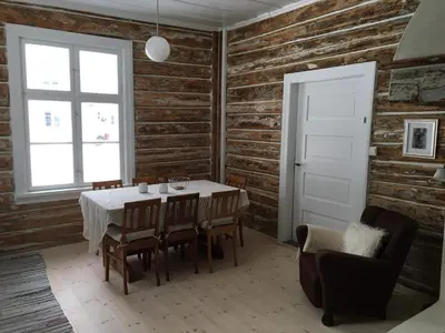 a dining room with a table and chairs and a window at Skjeggestad Gjestehus in Ringebu