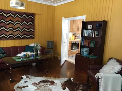 a living room with a couch and a table at Skjeggestad Gjestehus in Ringebu