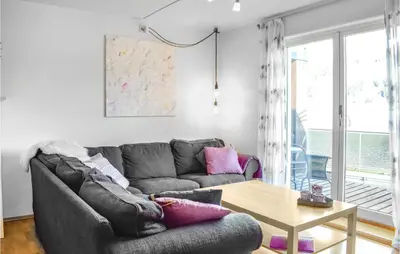 a living room with a couch and a table at Stunning Apartment In Vossestrand in Vossestrand