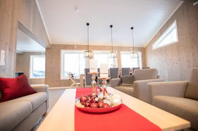 a room with a table with a bowl of fruit on it at Rolfhytta - Fosskamben 19 in Sogndal