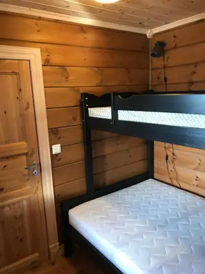 a bedroom with a bunk bed in a cabin at Harpefossen Skisenter og Hyttegrend in Nordfjordeid
