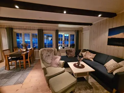 a living room with a couch and a table at Leilighet Gaustablikk in Rjukan
