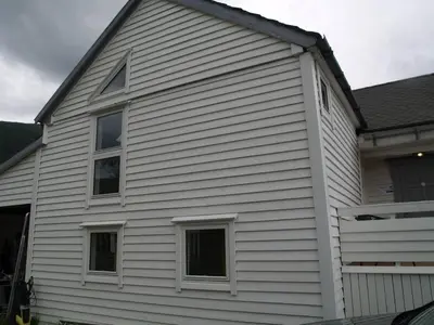a house with white siding and windows at Siloen - cosy apartment in Herand in Herand