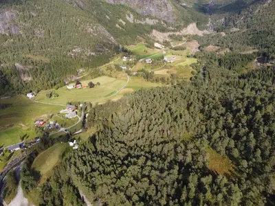 an aerial view of a village in a mountain at Old School på Eidslandet - exclusive apartment in Eidslandet