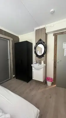 a bathroom with a sink and a mirror at BUDGET Kvamseter Lodge in Eikedalen