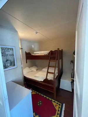 a small room with two bunk beds in it at Storehorn Apartments Hemsedal in Hemsedal
