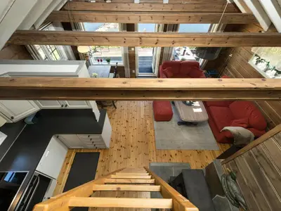 an overhead view of a living room with stairs and chairs at Holiday Home Strandbu by Interhome in Viksdalen