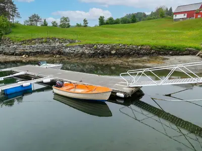 a small boat is docked at a dock at Holiday Home Havsblikk by Interhome in England
