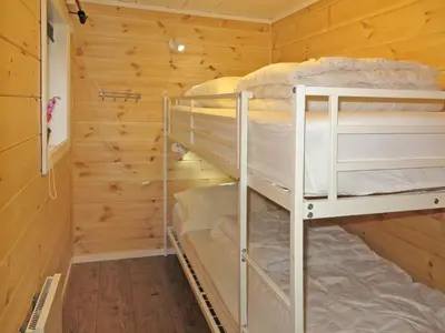 a bunk bed room with two bunk beds in a cabin at Holiday Home Tufto by Interhome in Lunde