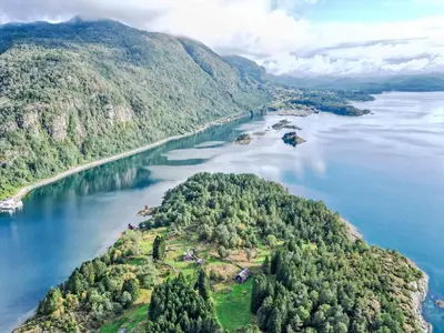 an island in the middle of a body of water at Holiday Home Elistova by Interhome in Onarheim