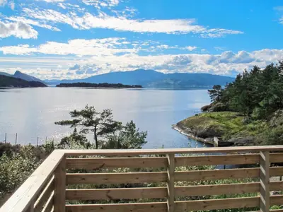 a view of a lake from a wooden fence at Holiday Home Rød Hytte by Interhome in Herand