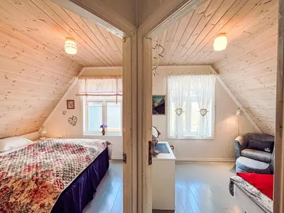 a bedroom with a bed in a attic at Chalet Villa Esefjord by Interhome in Balestrand