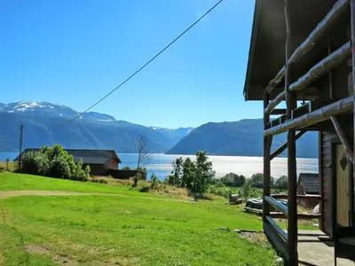 a house with a view of a lake and mountains at Chalet Målsnes by Interhome in Balestrand