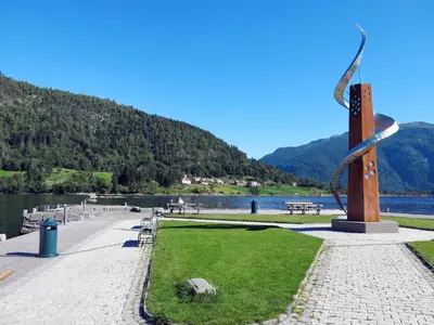 a sculpture in a park next to a body of water at Chalet Målsnes by Interhome in Balestrand