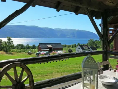 a view from the porch of a house with a view of a lake at Chalet Målsnes by Interhome in Balestrand