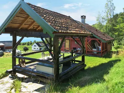 a gazebo with a roof on a field at Chalet Målsnes by Interhome in Balestrand