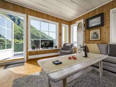 a living room with a couch and a table at Holiday Home Eseviki by Interhome in Balestrand