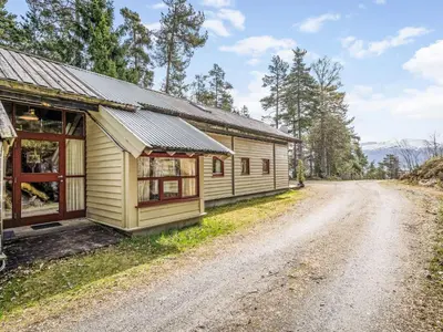 a house on the side of a dirt road at Holiday Home Veganeset I by Interhome in Balestrand