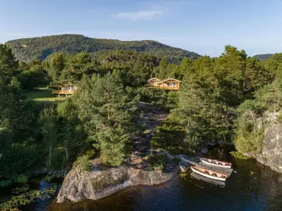 an aerial view of a house and boats in the water at Holiday Home Granlien by Interhome in Gjølanger
