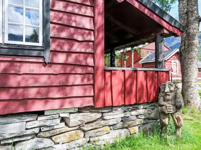 a stone bear statue in front of a house at Chalet Haukedalspanorama by Interhome in Holsen