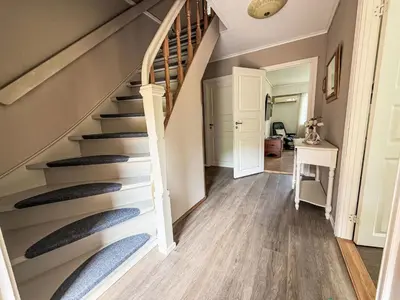 a hallway with stairs in a house at Holiday Home Kvamsvika by Interhome in Kvammen