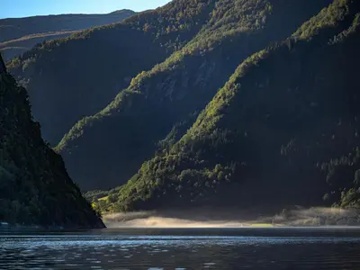 a view of a mountain range with a body of water at Holiday Home Tor by Interhome in Arnefjord