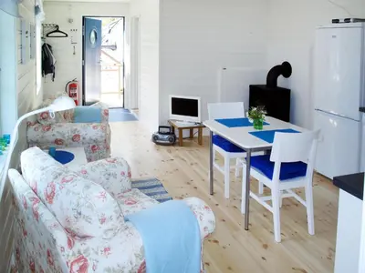 a living room with a couch and a table at Apartment Fagerdalsnipi by Interhome in Arnefjord
