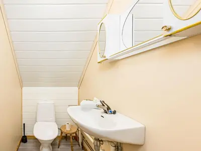 a bathroom with a sink and a toilet at Holiday Home Indresfjord by Interhome in Åse