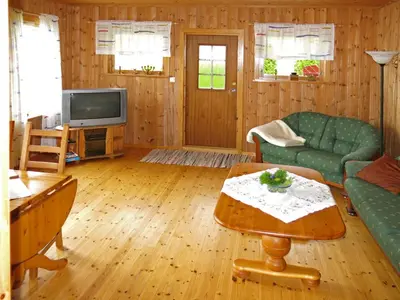 a living room with a couch and a tv at Holiday Home Nanna by Interhome in Hyllestad