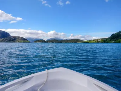 a boat on a large body of water at Holiday Home Idun by Interhome in Hyllestad