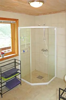 a shower with a glass enclosure in a bathroom at Holiday Home Peer Gynt by Interhome in Sogndal