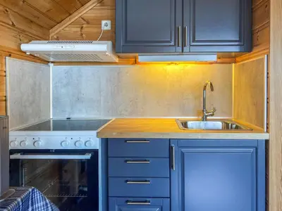 a kitchen with a sink and a stove at Chalet Hardangerrorbu by Interhome in Tjoflot
