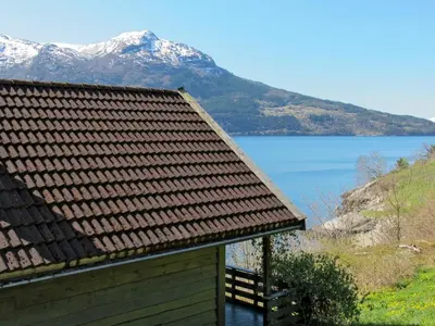 a roof of a building with a view of a lake at Chalet Slåttenes by Interhome in Naustflot
