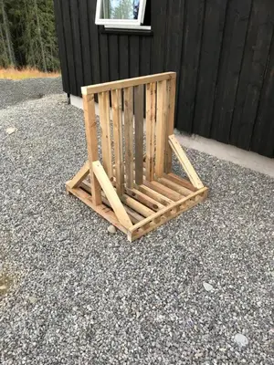 a wooden chair sitting on top of a pile of gravel at Lillebjørn in Trysil